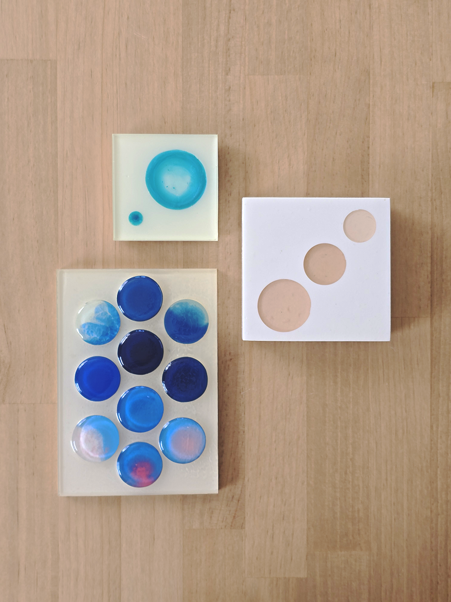 Three Sculptural Relief works of varying sizes and colors. All showing circular dots within a square or rectilinear space.