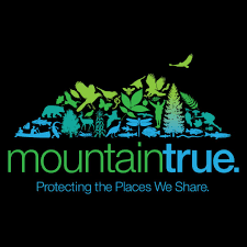 Logo with trees and animals on a black background, featuring the text 'mountaintrue'.